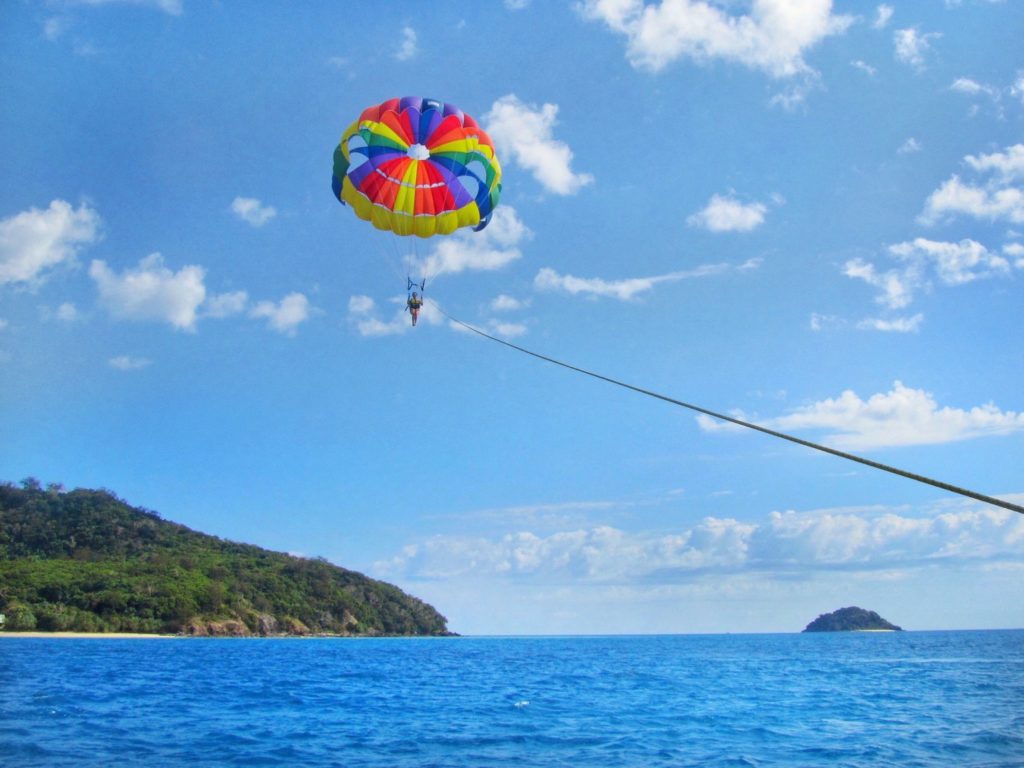 Parasailing high above Castaway Island, Fiji