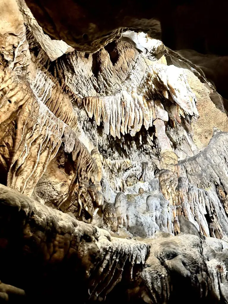 Close-up of intricate stalactites and stalagmites inside Ruby Falls cave, illuminated by soft lighting. Ruby Falls cave walk, Chattanooga, Tennessee