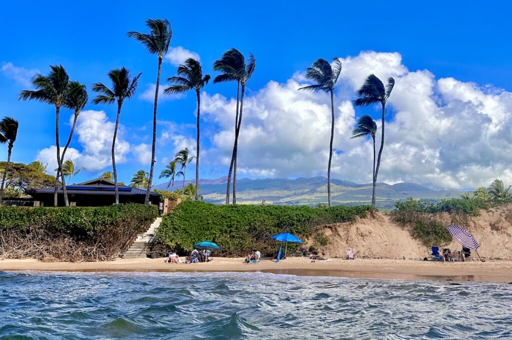 The beach at the Wailea Ehaki Village condos with the club house in the background. The stairs go up to the pool, which you can't see in this photo. 