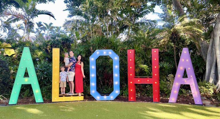 Family standing in Aloha sign at the Wailea Beach Resort - Marriott, Maui