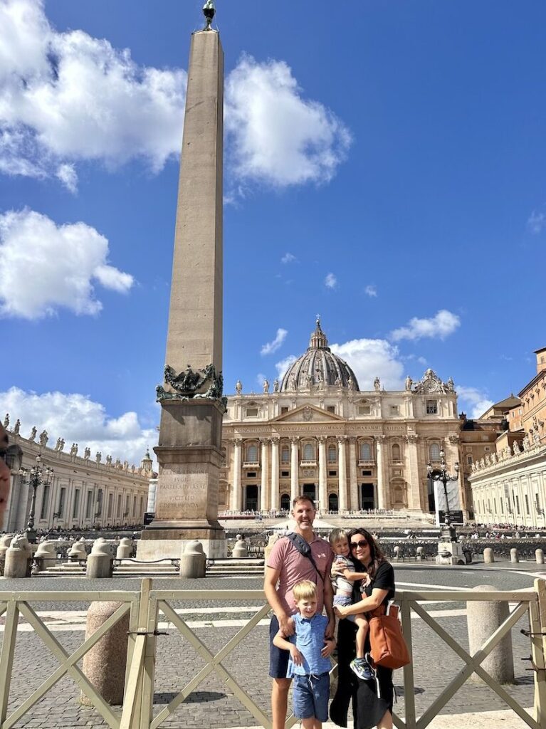 Family of four in front of the Vatican in Vatican City, Rome, Italy