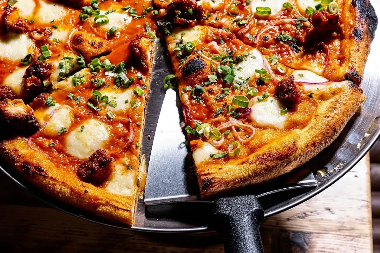 A close-up of a freshly baked pizza. Gordon Ramsay Street Pizza