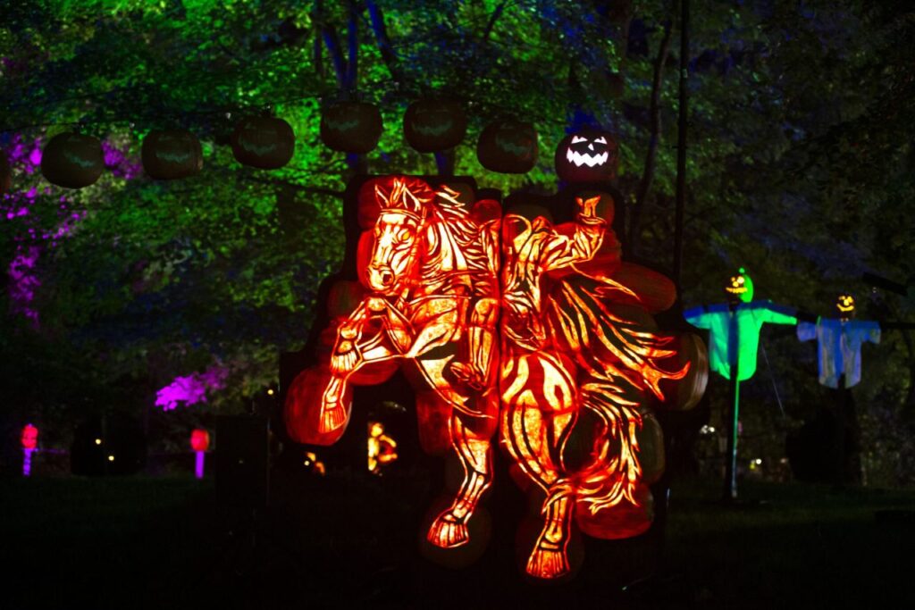 Glowing jack-o’-lantern display of the Headless Horseman riding a horse at the Great Jack O’Lantern Blaze in Sleepy Hollow, New York.