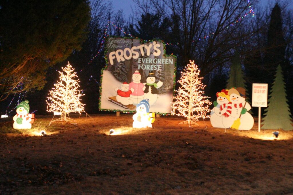 Holiday light display with snowmen and Christmas trees at Frosty’s Evergreen Forest. Santa Claus, Indiana. Christmas vacations for families