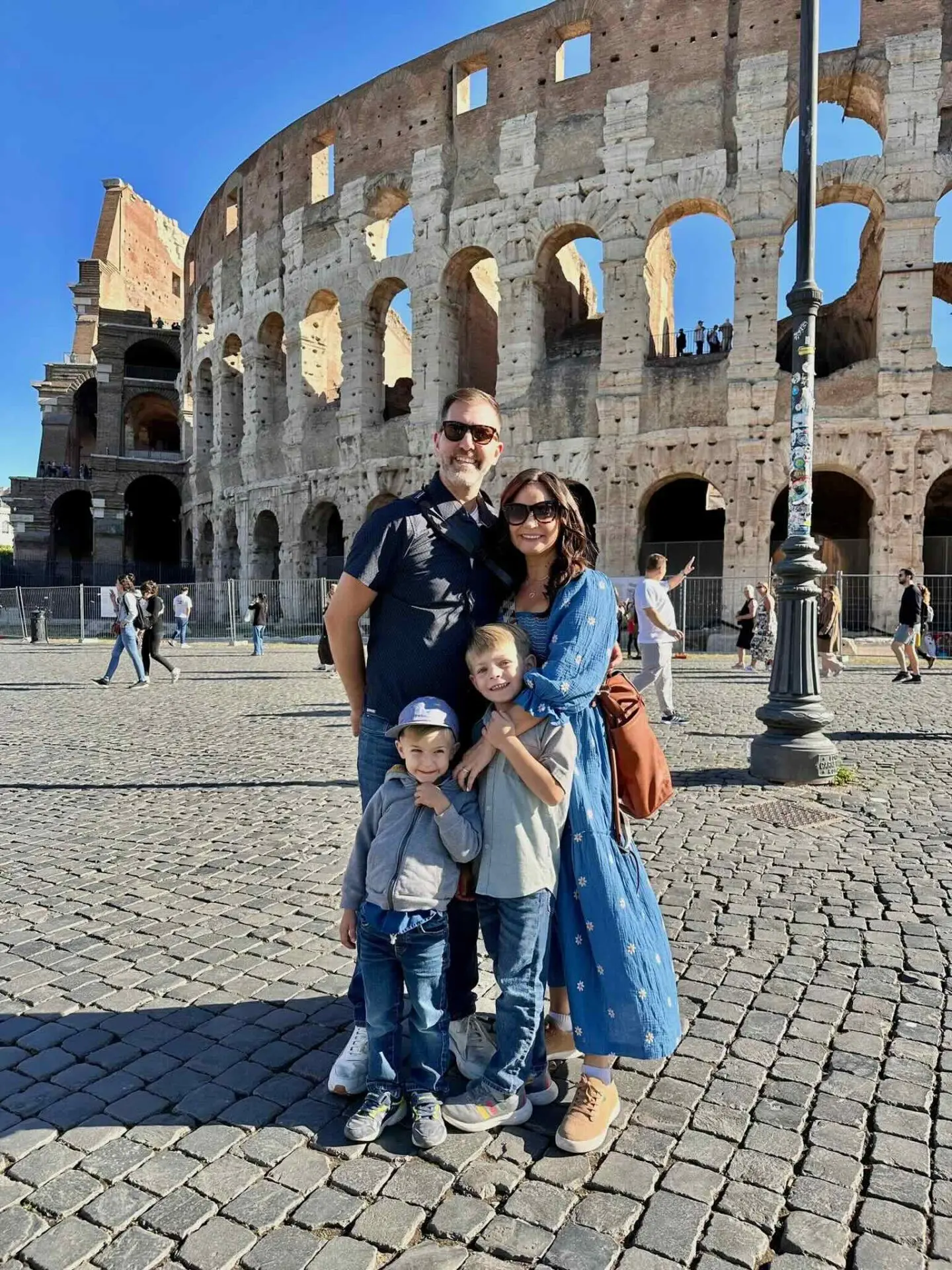 A family outside of the Colosseum Rome