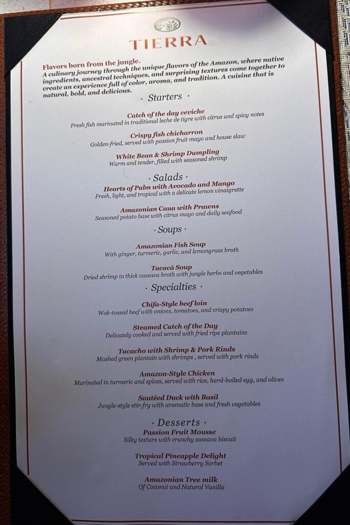 Tierra restaurant menu showing starters, salads, soups, specialties, and desserts with Amazon-inspired dishes