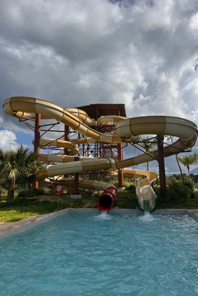 Water park at Dreams Playa Esmeralda with multiple twisting slides emptying into a splash pool