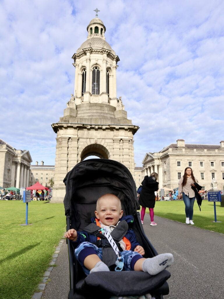 A baby in a travel stroller at Trinity College Dublin Ireland