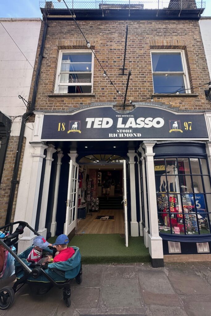 The official Ted Lasso Store on Paved Court in Richmond London with a double stroller parked outside
