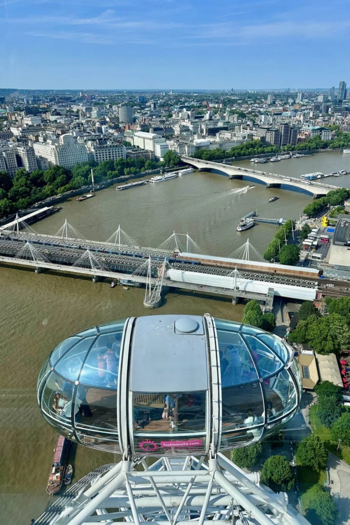 View from high on the London Eye looking down at another capsule and across the Thames to Hungerford Bridge.
