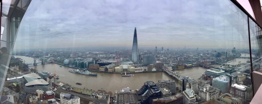 Panoramic view over the Thames from Sky Garden, with the Shard, Tower Bridge and HMS Belfast.