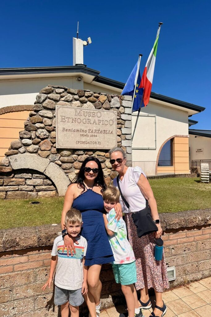 Mari, her mom and two sons in front of the Museo Etnografico Beniamino Tartaglia in Aquilonia, Italy